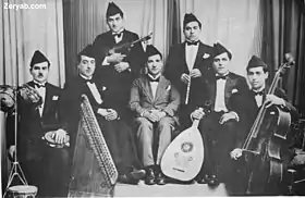 Image 35Iraqi music group led by Yusuf Za'arur in Baghdad, wearing the   sidara, ca 1930. (from Music of Iraq)