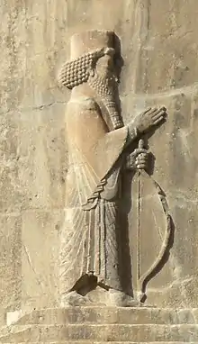 Stone relief of monarch, facing right