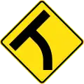 (W2-14) T-junction beyond a curve on left