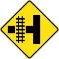 (W7-12) Railway Level Crossing on Side Road (left)