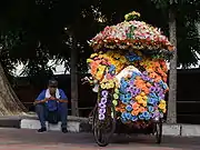 An extensively decorated trishaw in Melaka.
