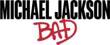 "MICHAEL JACKSON" in black type and "BAD" in red spray graffiti.