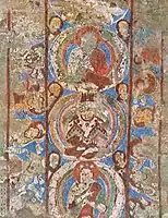 Bamyan Buddhas, the central one wearing a crown and an Iranian cape.