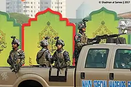 Bangladesh Navy SWADS operatives displaying an M4 Carbine and M240B