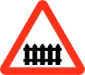 Railway level crossing with gate or barrier