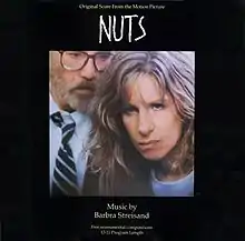 Streisand and Richard Dreyfuss appear on the cover standing next to each other with glares on their faces.
