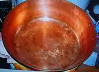 A copper bowl for cooking confiture