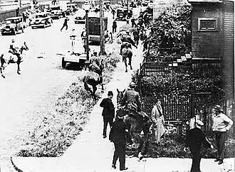 Image 55Mounted police chase demonstrators through Vancouver's East End during the Battle of Ballantyne Pier in 1935.