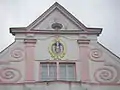 Façade of the town hall with the coat of arms