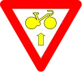 B23: Bike may pass a yellow or red light to go straight, after yield