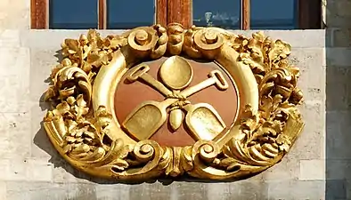 Baroque cartouche, mostly gilded, on the Maison du Moulin à vent, Bruxelles, Belgium