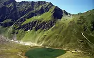 The Bergersee Hut ({{Subst:Formatnum:2181}}&nbsp;m) (below the Goldeckscharte notch), seen from the ascent to the Berger Kogel (1980)