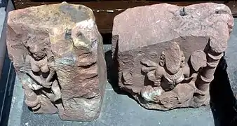 Carved rock fragments near the entrance