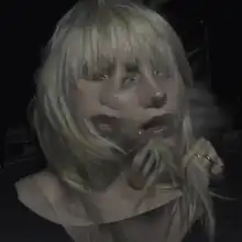 Cover art for "NDA": two overlapping images of Billie Eilish's head