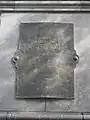 Plaque identifying the donor and sculptor