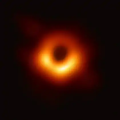 Fuzzy donut-shaped blob on a black background