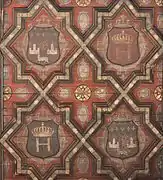 Henry IV courtyard, coats of arms under the awning. The geometric motifs evoke the Mudejar style, but also Serlio's engravings (redesigned after the Renaissance).