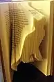 Cat formed from folded pages of a book