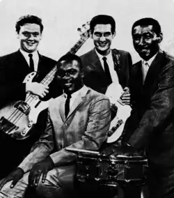 Booker T. & the M.G.'s c. 1967 (L–R): Donald "Duck" Dunn, Booker T. Jones (seated), Steve Cropper, Al Jackson Jr.