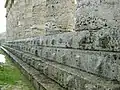 The crepidoma (base) of the Temple at Segesta, Sicily, showing a boss on each piece of stone to aid lifting. The bosses would have been removed when the temple was completed.