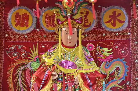 Statue of a Chinese goddess Shui Wei Sheng Niang during a procession for the Lunar New Year in Paris.