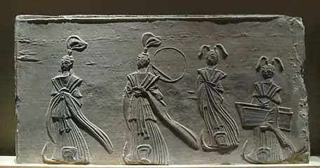 Brick relief depicting two scholars and two maids, from the Southern Dynasties