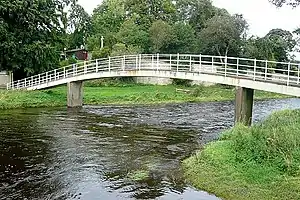Bridge over the Coquet at Rothbury. This pedestrian bridge links the car park (right) with the town (left).