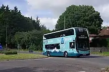 A Brighton & Hove bus in 'Live & Breathe' livery on route 5B in Falmer