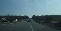 Interstate 76 passes through the wooded hills of Brimfield Township