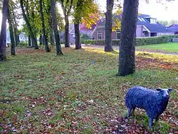 The brink (communal pasture) of Loon with a sheep statue