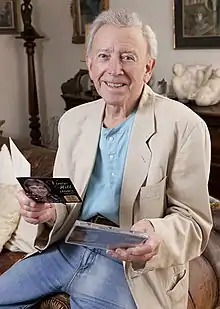Hill at his Oxfordshire home holding his 55th anniversary Legacy hits CD, June 2017