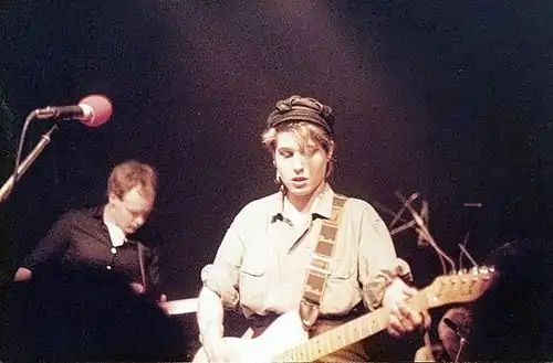 Steve Hanley (left) and Brix Smith onstage with the Fall at the Markthalle Hamburg, Perverted By Language Tour, April 13, 1984