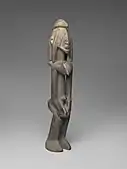 Female or male figure; probably early 17th century; 40.0 x 7.3 x 7.8&nbsp;cm (15.mw-parser-output .frac{white-space:nowrap}.mw-parser-output .frac .num,.mw-parser-output .frac .den{font-size:80%;line-height:0;vertical-align:super}.mw-parser-output .frac .den{vertical-align:sub}.mw-parser-output .sr-only{border:0;clip:rect(0,0,0,0);clip-path:polygon(0px 0px,0px 0px,0px 0px);height:1px;margin:-1px;overflow:hidden;padding:0;position:absolute;width:1px}3⁄4 x 2 7/8 x 3 in.); Brooklyn Museum