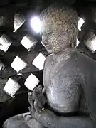 A Buddha statue inside a stupa