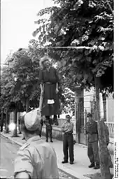 A woman executed by public hanging in a street of Rome, early 1944