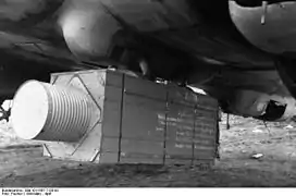 Food supply crate mounted under a German He 111 bomber, 1944