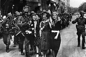 Women greeting German soldiers in Riga