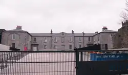 Gallery building seen through gates