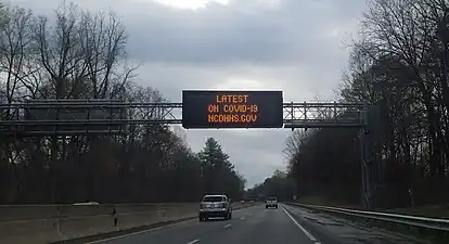 A sign in Winston-Salem, North Carolina, USA, displaying the website for information on COVID-19 in North Carolina.