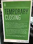 A sign for a Milwaukee/Chicago coffee shop chain in their Oconomowoc location indicates that the business has closed, their manufacturing operations will be unaffected, and employees will continue to be paid (the closure date on the sign has since extended further to the end of the stay-at-home order).