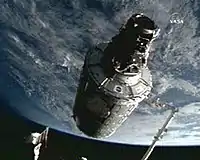 Canadarm2 moving the Harmony module into position on the ISS