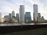 The Canary Wharf and Isle of Dogs business district as viewed from the south-west, December 2019. The tallest building in this cluster is One Canada Square with the pyramid-shaped roof which was completed in 1991 and stands at 235m
