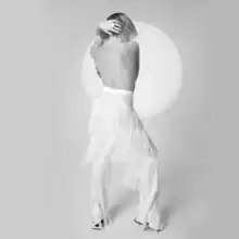 Black-and-white photograph of Carly Rae Jepsen from behind