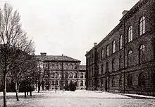 Photograph of two educational building surrounding a commons