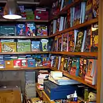 Graphic novels on display for sale in a specialist shop.