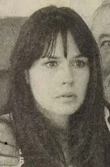 Black and white image of Catherine Wilkening looking left of the camera