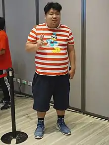 Chang holding up a V sign