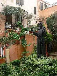 Statue of Francis of Assisi outside the Catholic church of Chania