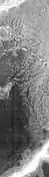 Channels West of Echus Chasma.  The fine pattern of branching stream beds were probably formed from water moving across the surface.  Image taken with THEMIS.
