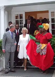 Charles and Camilla stand next to each other in Jamaica
